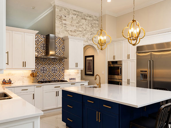 Luxury custom kitchen with white cabinetry and blue island by kitchen cabinet makers in Sydney