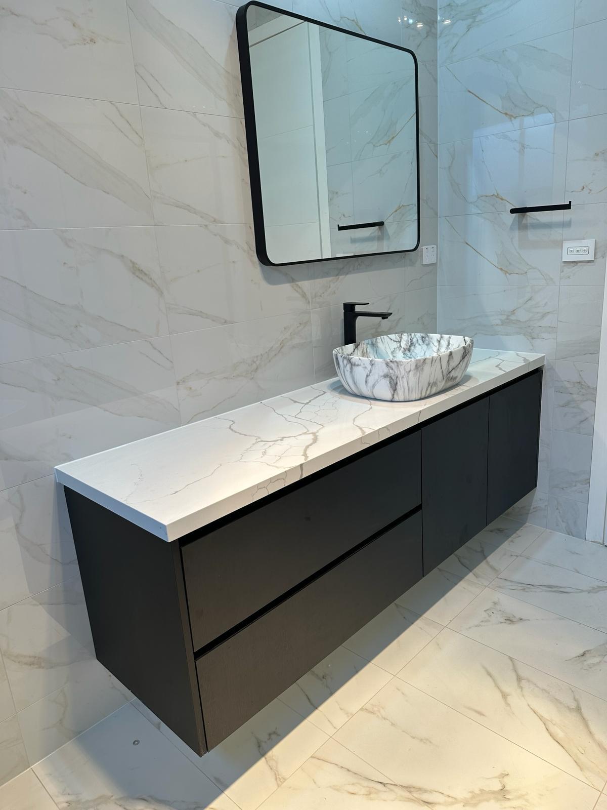 Custom dark floating bathroom vanity with marble-look vessel basin and stone benchtop