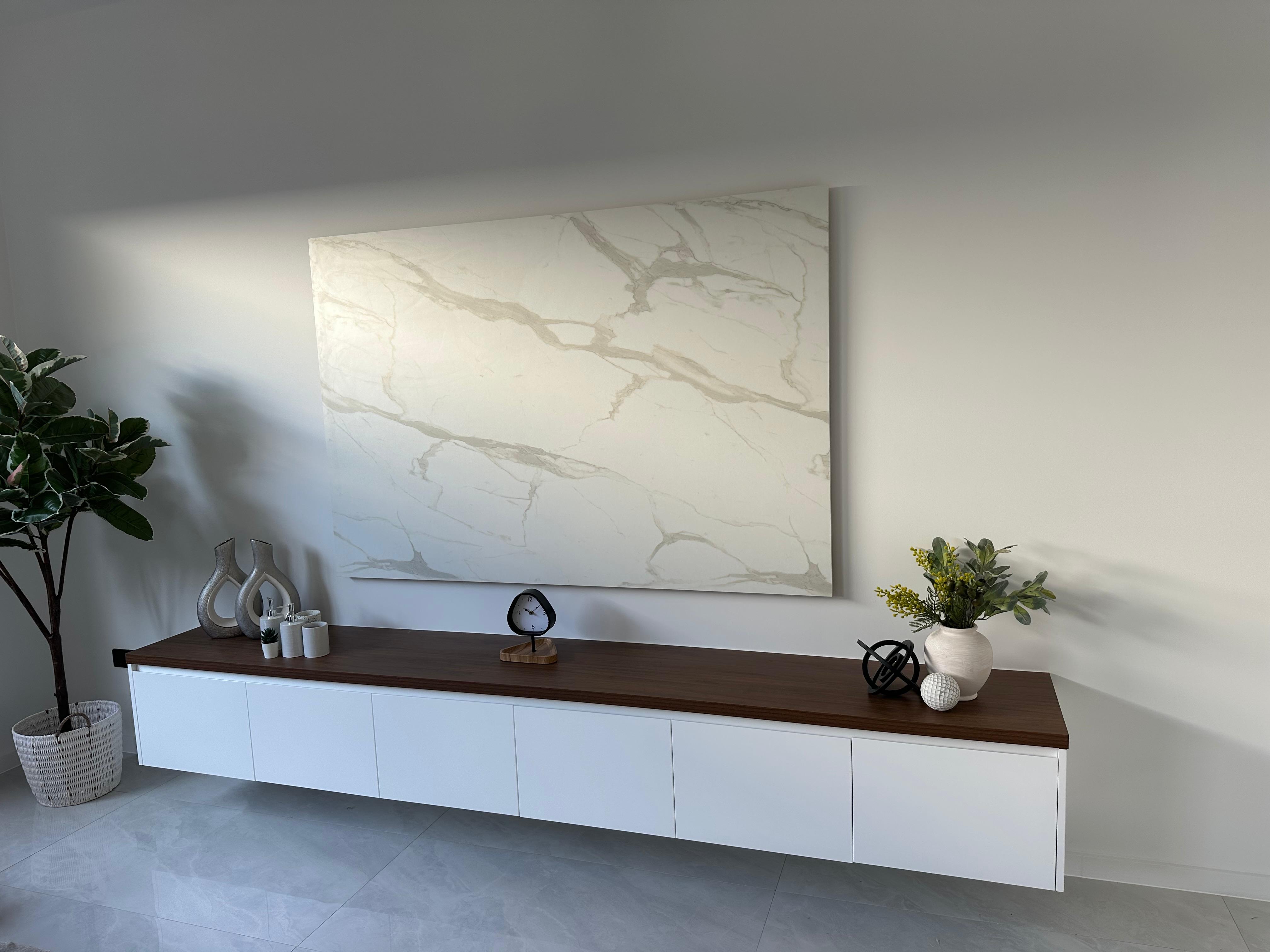 Custom floating white sideboard with timber benchtop and marble feature wall panel