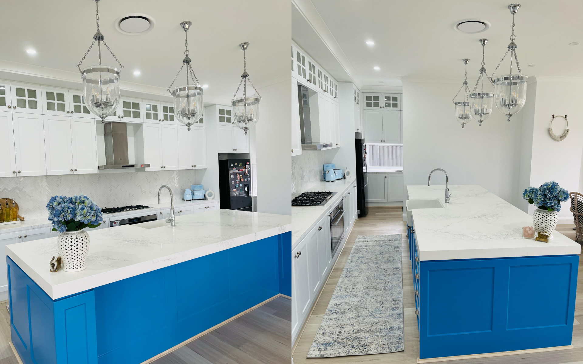 Modern white kitchen with blue island cabinets, quartz countertops, pendant lighting, and built-in storage.